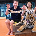 posing with small tiger
